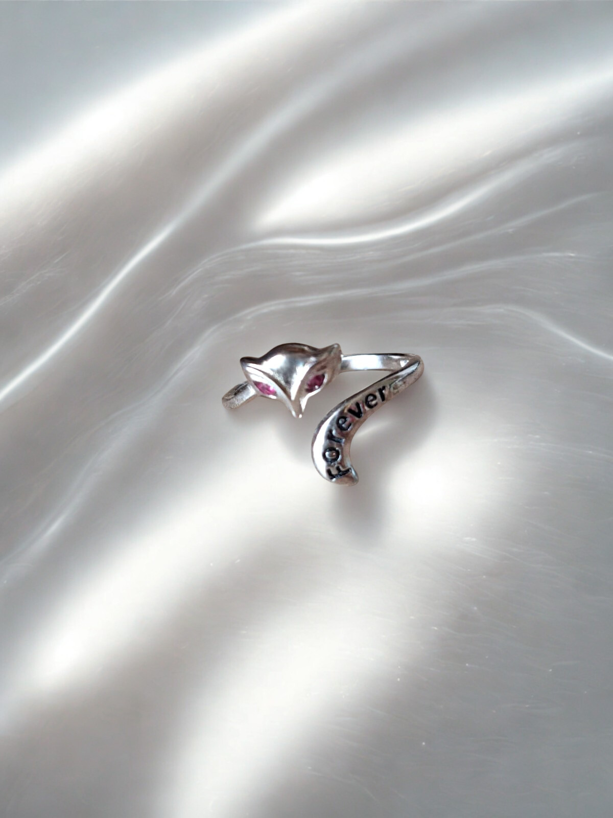 92.5 Silver ring with owl design and 'forever' engraving on a satin surface